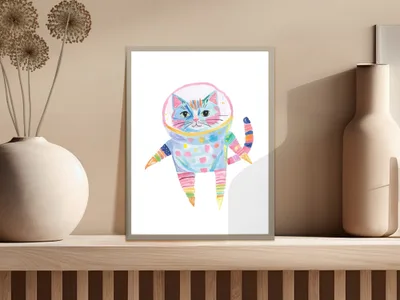 Astronaut cat in colorful spacesuit, floating in space, in a framed print.
