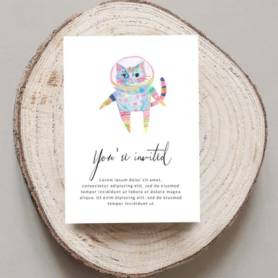 Watercolor astronaut cat with colorful stripes on an invitation.