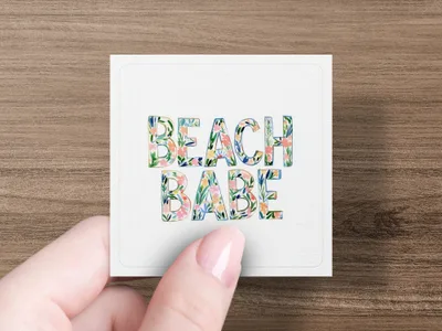 Square card with "BEACH BABE" text in floral lettering.