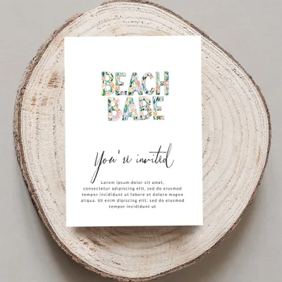 Beach Babe invitation with floral letters and sample text.