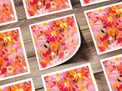 Vibrant Floral Art Prints on Rustic Wooden Surface