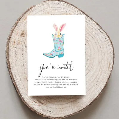 Invitation with floral cowboy boot and bunny ears, "You're invited".