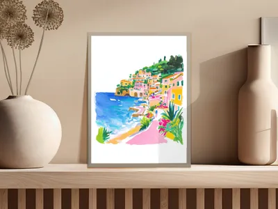 Colorful village on a coastline with blue ocean and green hills.