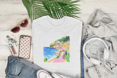White crewneck t-shirt with colorful coastal town watercolor print.