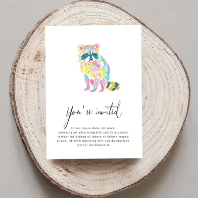Greeting card with colorful watercolor raccoon and "You're invited" text.