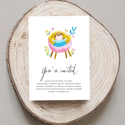 Invitation with baby in manger illustration and "You're invited" text.