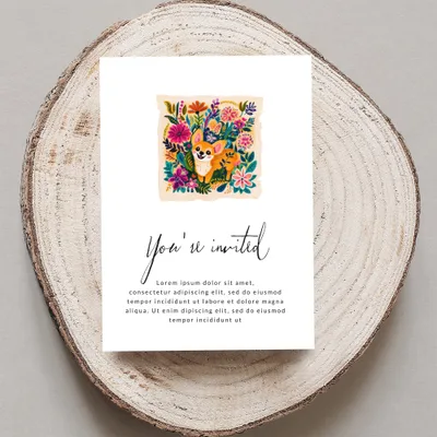 Invitation with a corgi illustration and floral border, reading "You're invited".