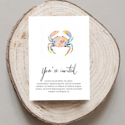 Illustrated crab on a "You're invited" card with placeholder text.
