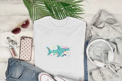 White t-shirt with cartoon shark wearing a hat and bow tie.