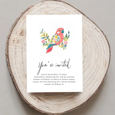 Invitation card with floral parrot illustration and "You're invited" text.