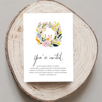 Invitation with floral border and "You're invited" text.
