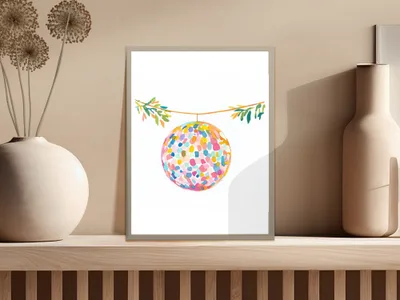 Colorful disco ball painting hanging from a string.