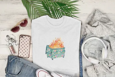 White t-shirt with a graphic of a burning dumpster with flowers.
