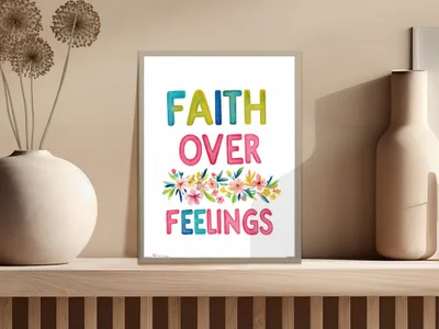 Faith Over Feelings motivational art print with colorful text and floral accents.