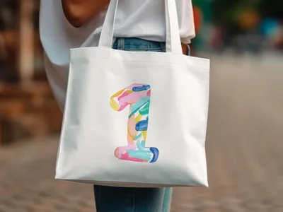 White tote bag with colorful abstract number "1" design.