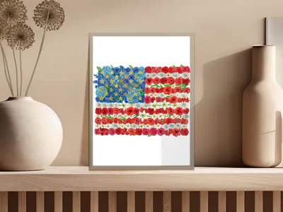 American flag made of red poppies, blue flowers, and white stars.