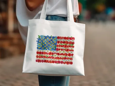 White tote bag with American flag design made of flowers.