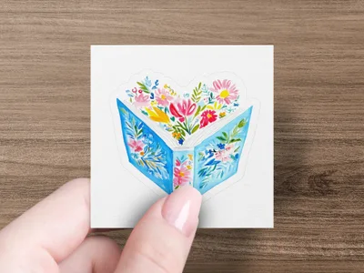 Open book with colorful flowers blooming from pages.