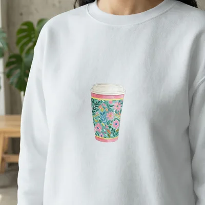 White sweatshirt with a watercolor floral coffee cup design.