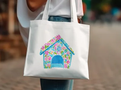 White tote bag with a colorful floral dog house illustration.