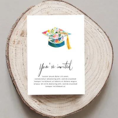 Graduation invitation with floral cap, "You're invited" text, and placeholder copy.
