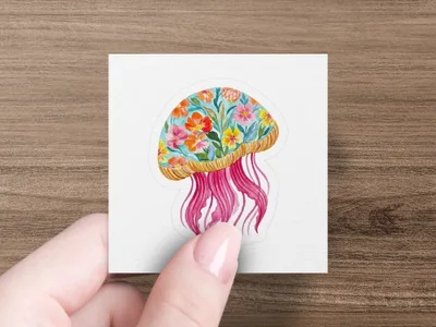Jellyfish sticker with floral-patterned bell and pink tentacles.