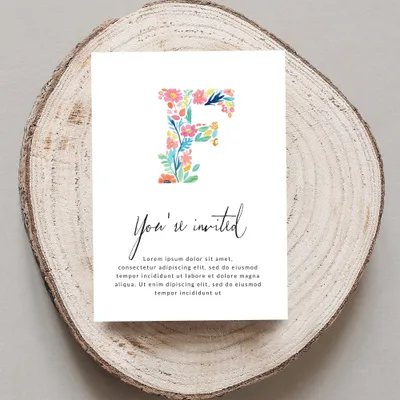 "You're invited" card with floral letter F and placeholder text.