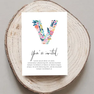 Invitation with floral 'V' and "You're invited" text.