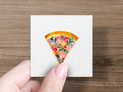 Slice of pizza topped with colorful floral design.