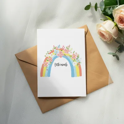 Greeting card with rainbow and floral design, says "little miracle."