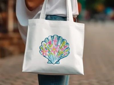 White canvas tote bag with a watercolor illustration of a pink seashell and flowers.