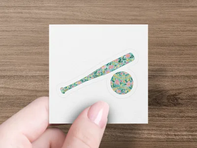Baseball bat and ball with floral pattern.