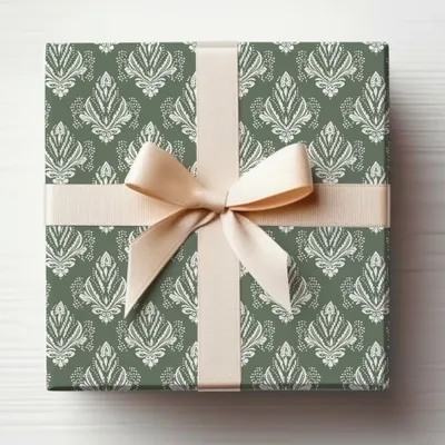 Elegant Green Patterned Gift Box with White Ribbon