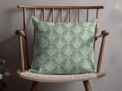 Elegant Green Throw Pillow with Intricate Floral Design