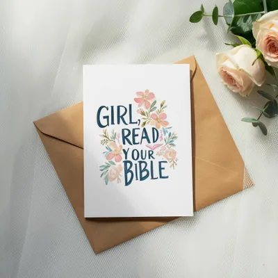 Greeting card with "Girl, read your Bible" text and floral design on an envelope.