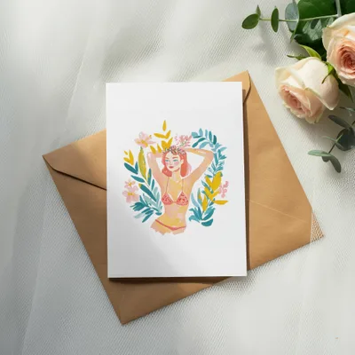 Woman in bikini surrounded by floral wreath, on a brown envelope.