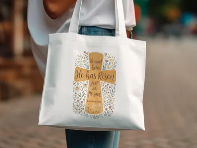 Tote bag with "He is not here; He has Risen just as He said Matthew 28:6" text and floral design.