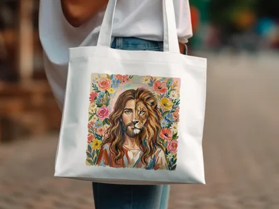 Jesus with a lion's face surrounded by colorful flowers on a white tote bag.