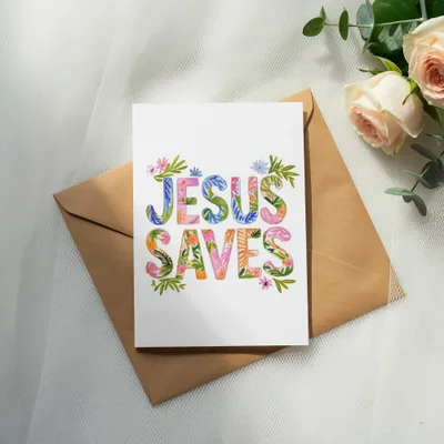 Jesus Saves card with floral lettering on brown envelope.