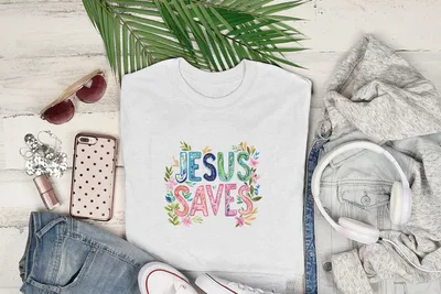 White t-shirt with "Jesus Saves" in colorful floral letters.