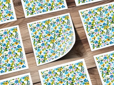 Floral pattern on square cards with a wooden background.