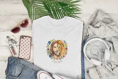 White t-shirt with watercolor portrait of Jesus as the Lion of Judah surrounded by flowers.