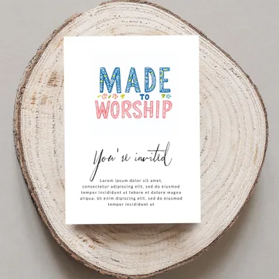 Invitation card with "MADE TO WORSHIP" text, on a wooden slice.