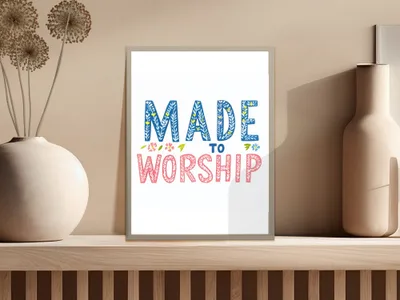 Framed art print with text "MADE TO WORSHIP" in colorful lettering.