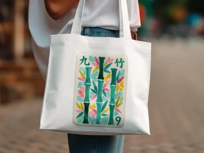 White tote bag with bamboo and floral design, featuring the number 9.