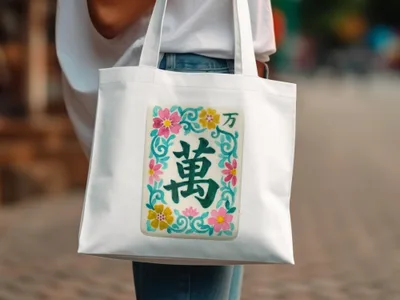 White tote bag with floral and Chinese character design.