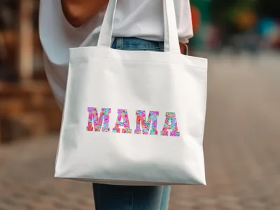 White tote bag with colorful "Mama" text.