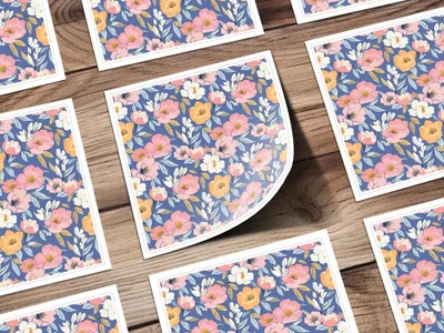 Square cards with a floral pattern featuring pink and orange flowers and blue leaves.