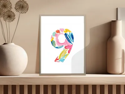 Watercolor number nine with colorful abstract brushstrokes on white paper.