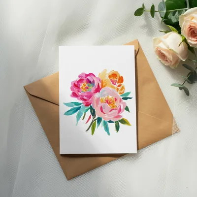 Floral watercolor painting on a card with envelope and roses.